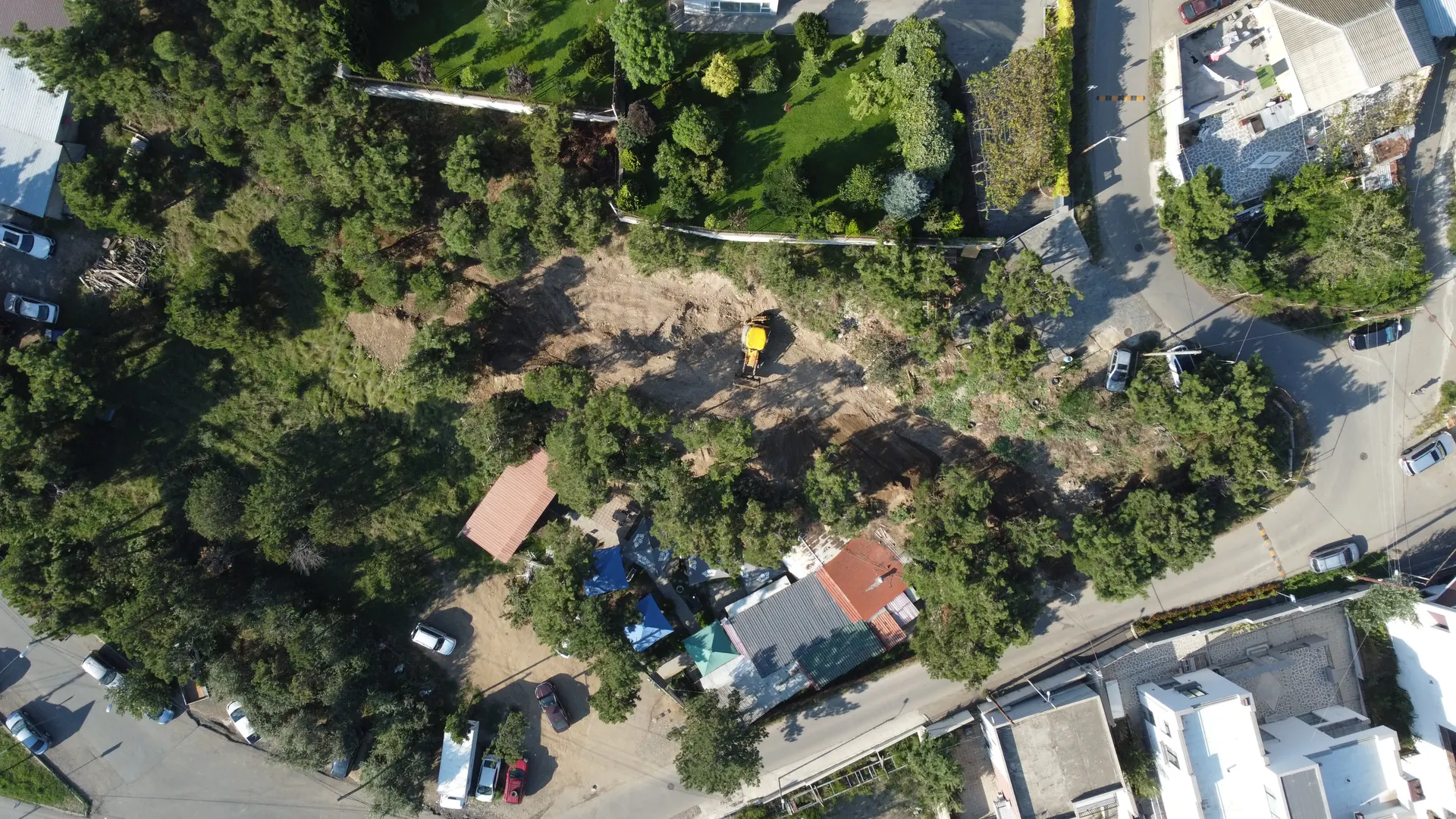 Top-down drone photograph of the Lisi Lake plot and the adjoining municipal land — current condition, September 2026