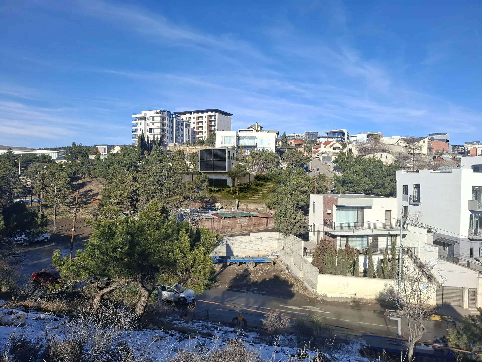 Photomontage of the approved Lisi Lake house placed on a photograph of the hillside site — not current condition