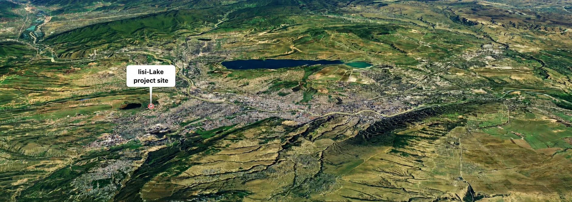 Aerial city-context view of Tbilisi with the Lisi Lake project site marked